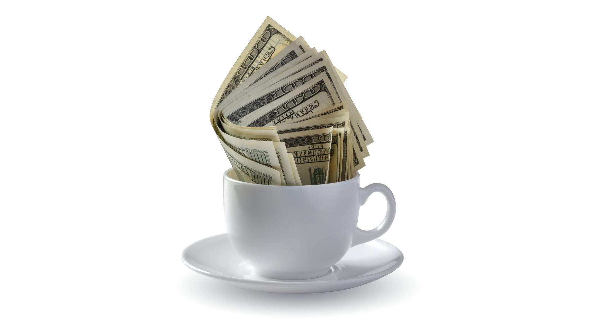 Money in coffee cup
