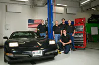 Tech Team In Garage Setting Tech Team In Garage Setting