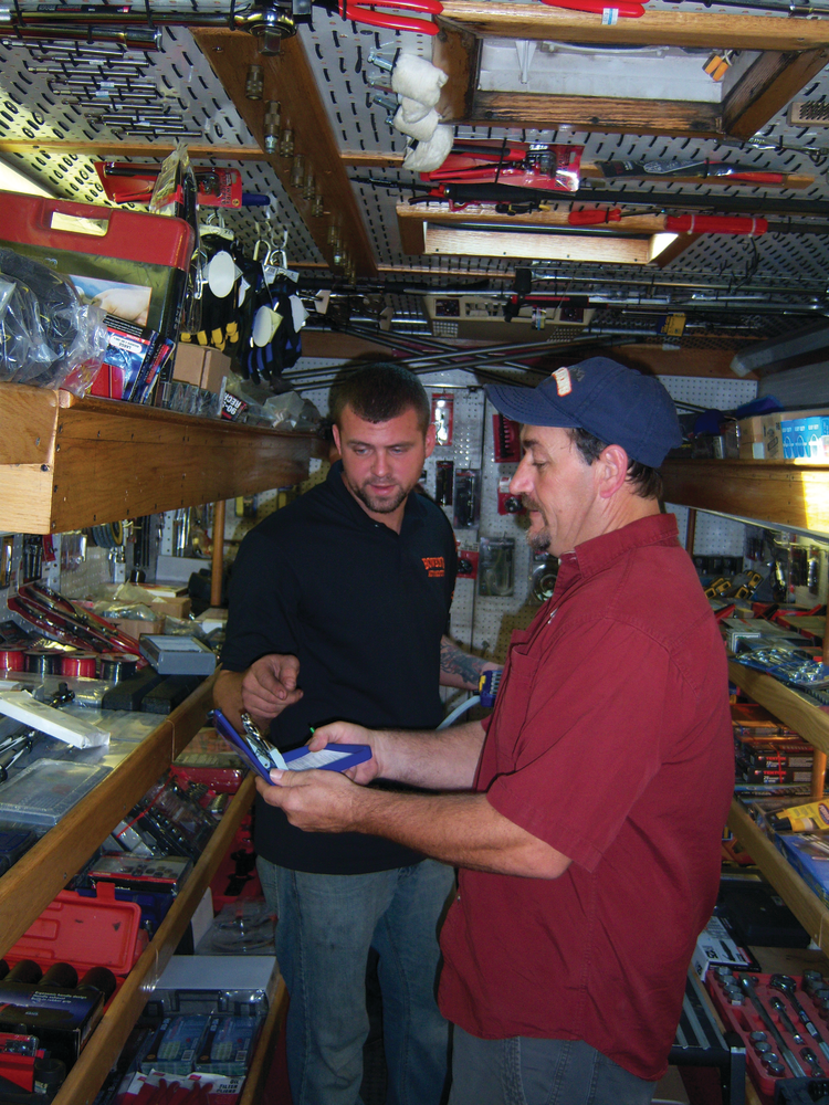 A customer examines a new pair of pliers.