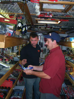 A customer examines a new pair of pliers. A customer examines a new pair of pliers.