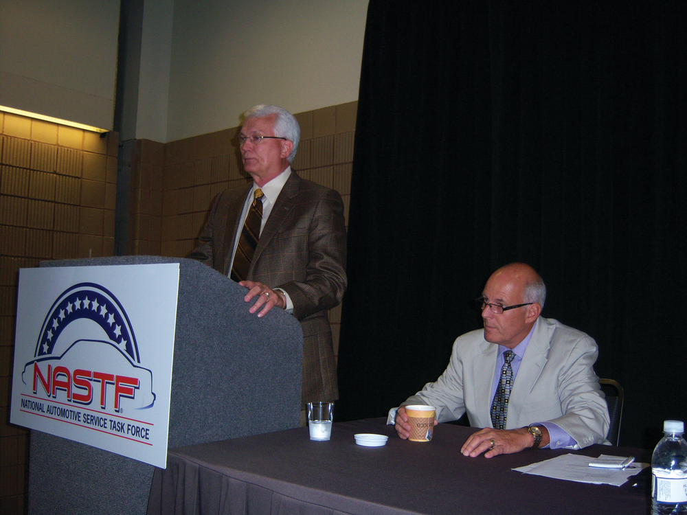 Ron Pyle, chairman of NASTF, at left, announces Skip Potter as the NASTF's first executive director during the ASRW show in New Orleans.