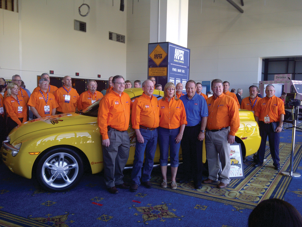 Participating in the grand prize presentation at AAPEX at the Sands Expo in Las Vegas are, at left: Cliff Hovis; John James, winner of the Federated 'Let it Ride' Sweepstakes; Betty James; Kenny Schrader; and Curt Hovis.
