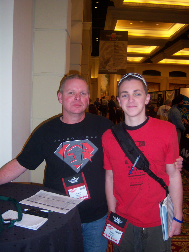 Wayne Rathbun and his son, Aaron Rathbun, take in the displays during the Matco Tools distributor tools show in San Diego, Calif.