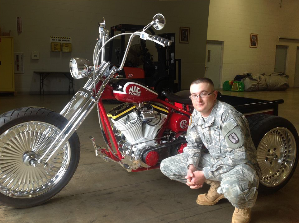 Donovan Finch receives his winning trike for Mac Tools 75th anniversary.