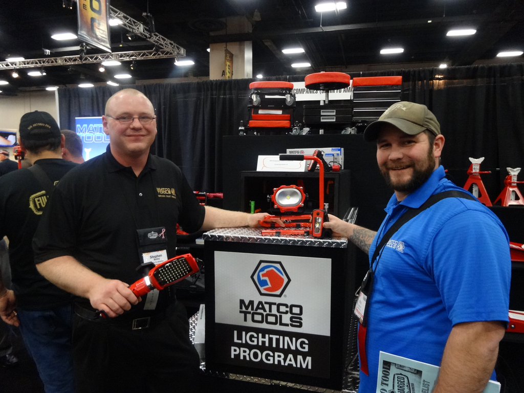 Steve Bailey, left, of SFA Companies, Inc. presents the 10W COB aluminum cordless light to Nick Bowden of Watertown, S.D.