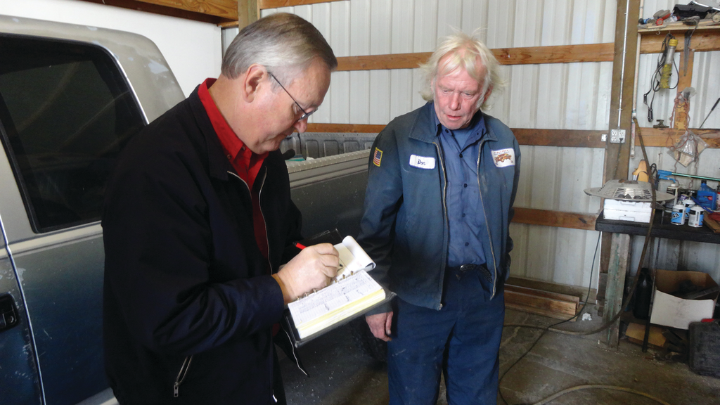 Shipler fills out a receipt for a customer.