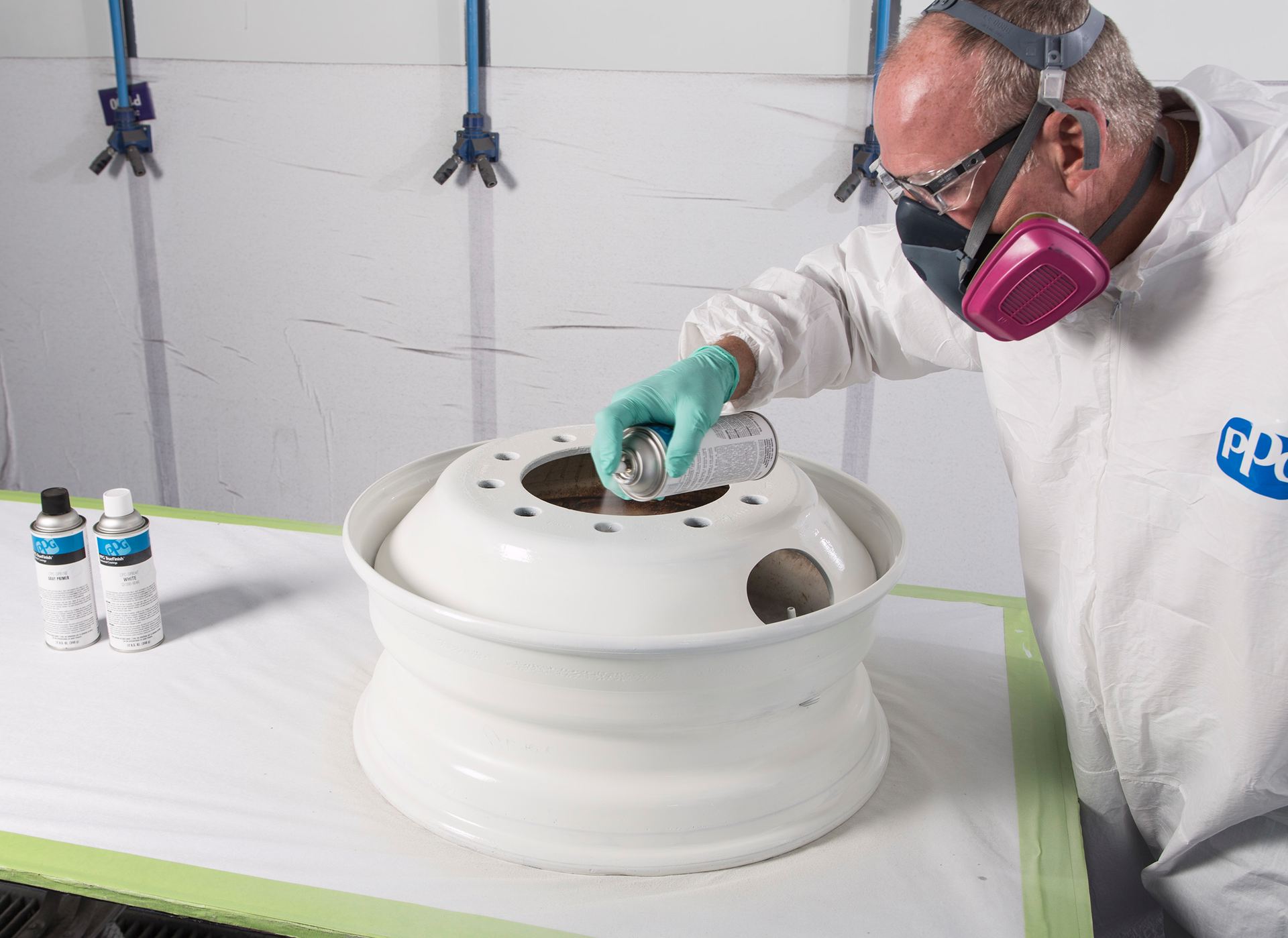 Step 4: Applying two wet coats of PPG CPC-SP8047 (white) or CPC-SP8050 (black) topcoat.