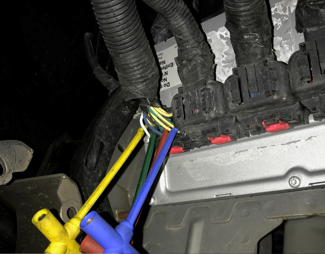Fig. 3 - The PCM was located within the left-front fender well of the vehicle (shown here).