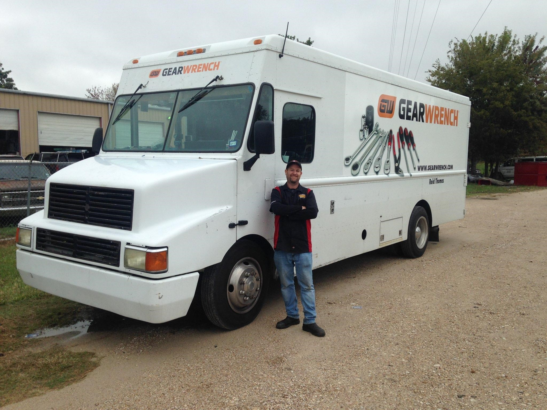 A GEARWRENCH mobile tool dealer stands proudly in front of his truck.