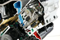 FIG2- This HEUI uses high-pressure oil (from the crankcase) to drive a piston and produce pressurized fuel. An electrical solenoid allows the pressurized oil to act on the piston. FIG2- This HEUI uses high-pressure oil (from the crankcase) to drive a piston and produce pressurized fuel. An electrical solenoid allows the pressurized oil to act on the piston.