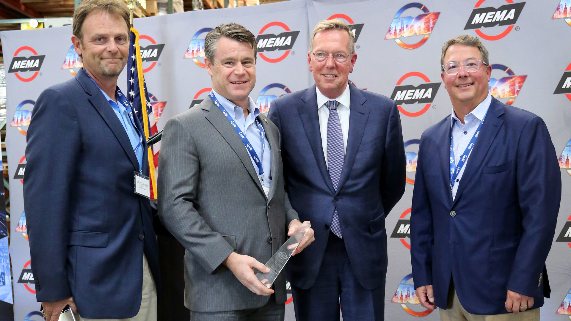 Honoring Sen. Todd Young (second from l.) with the Joseph M. Magliochetti Industry Champion Award are, from l., Bob Courtney, Mayor of Madison, Ind.; Bill Long, president and CEO of MEMA; and Dominic Grote, president and CEO of Grote Industries.