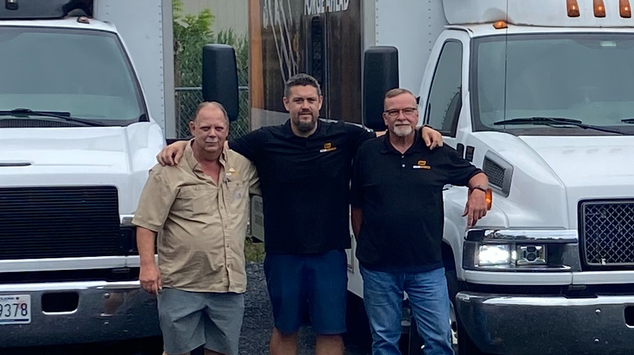 Vernon with his two other drivers