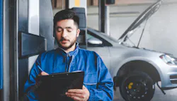Technician writing on a clipboard Technician writing on a clipboard