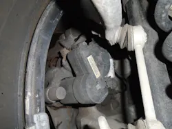 Figure 1: This is an image of a left rear EPB caliper. The black actuator motor is attached to the back of the caliper. Figure 1: This is an image of a left rear EPB caliper. The black actuator motor is attached to the back of the caliper.