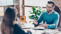 Manager and employee in office Manager and employee in office