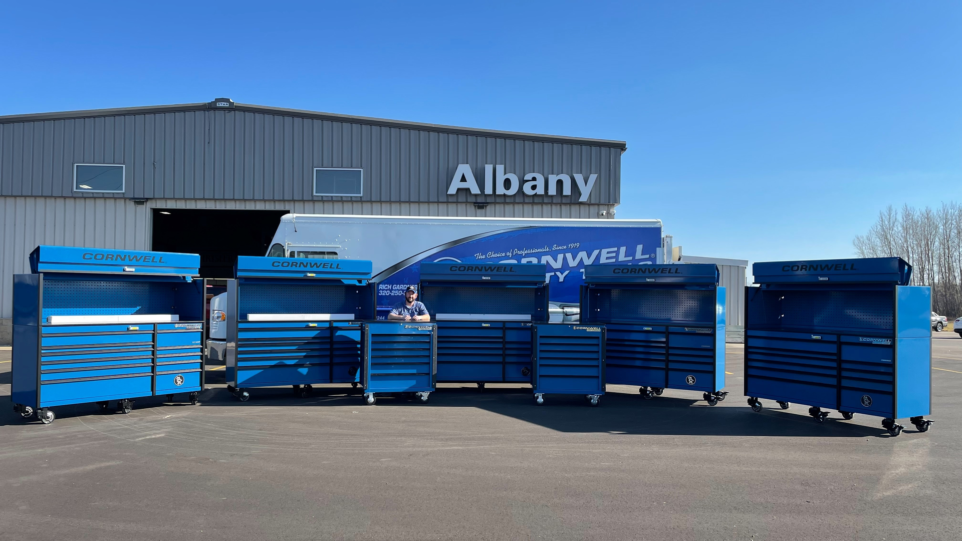 Rich Gardner pictured with the first delivery of his first big sale - modular toolboxes and service carts.