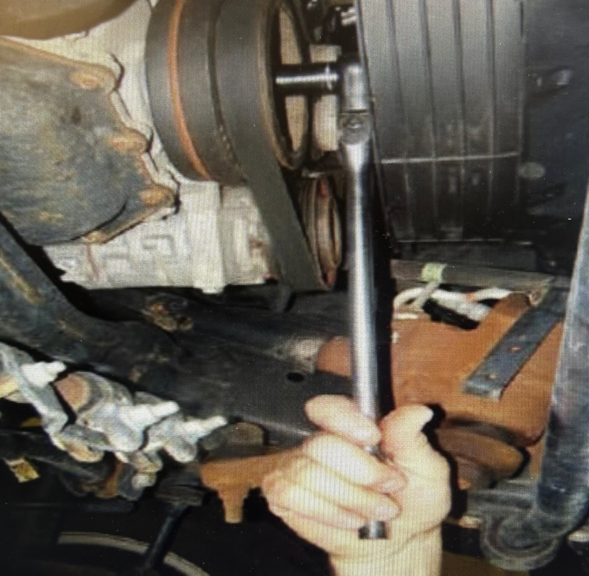 With the starter removed, rotate the crank until the bar code label on the converter is visible.