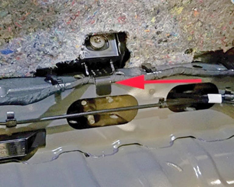 Inspect the rear harness for pinch damage.