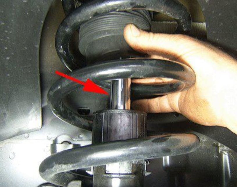 Apply dielectric silicone grease to the strut shaft.