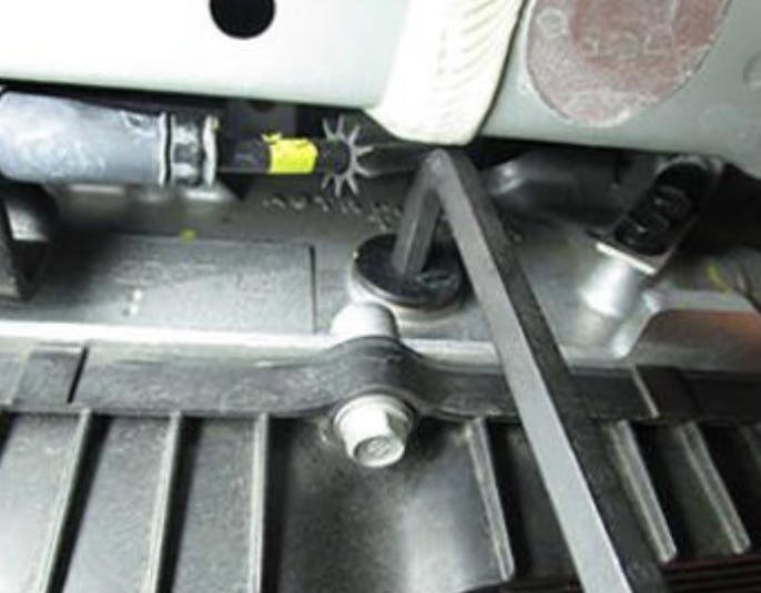 Use an eight-millimeter or 5/16-inch hex wrench to service the fill plug and washer.