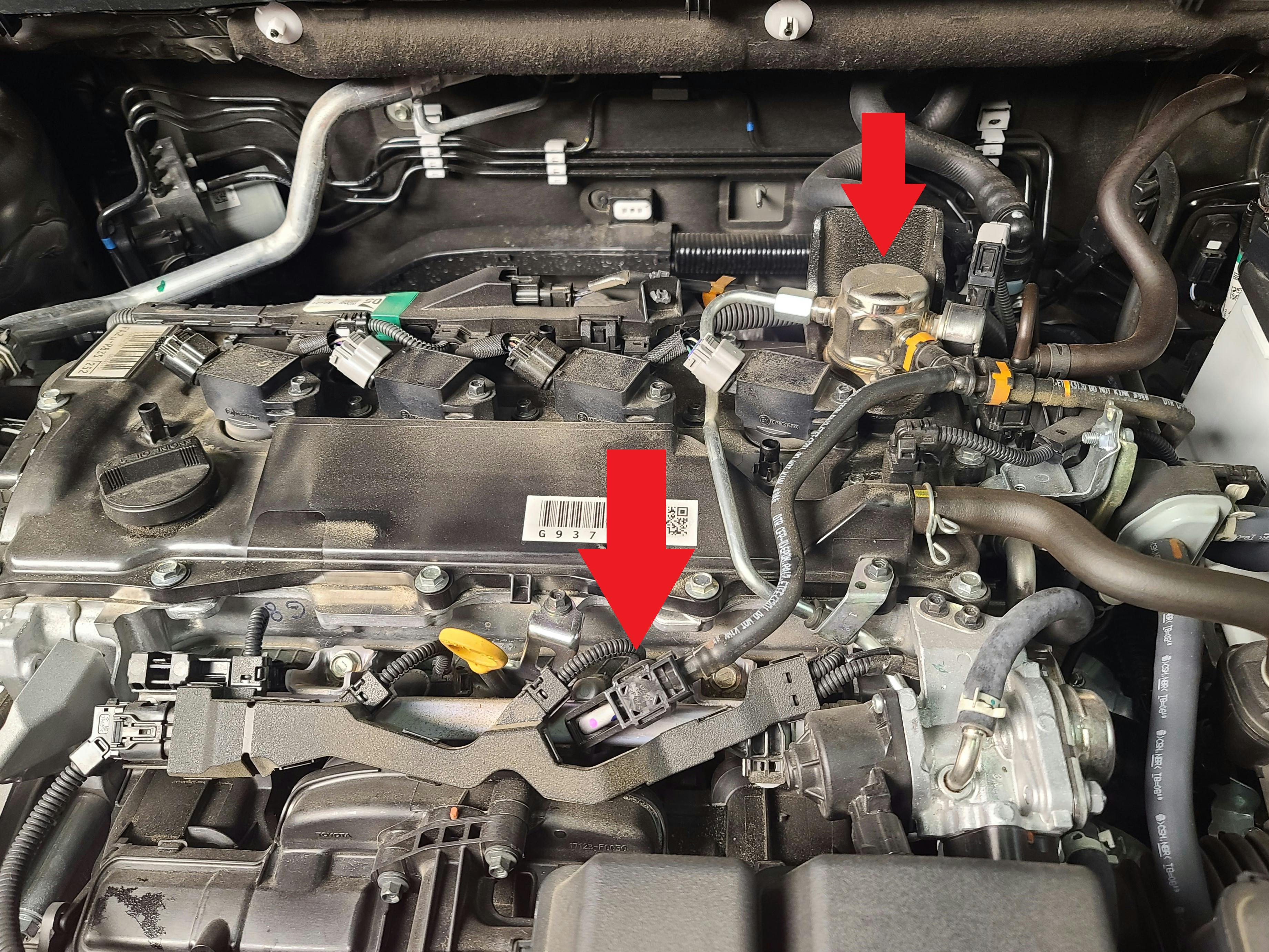 You can see the high-pressure fuel pump on the valve cover that feeds the GDI injectors, and you can also see the Port Fuel Injectors supply line coming off the high-pressure pump and heading to the Port Fuel Injectors under the plenum.