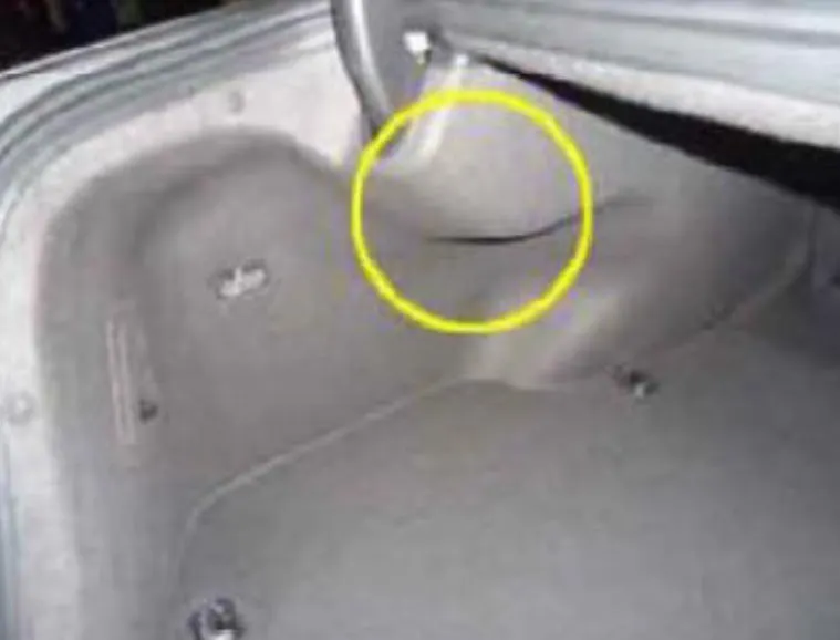 Access to the FPCM is through the left side of trunk trim.
