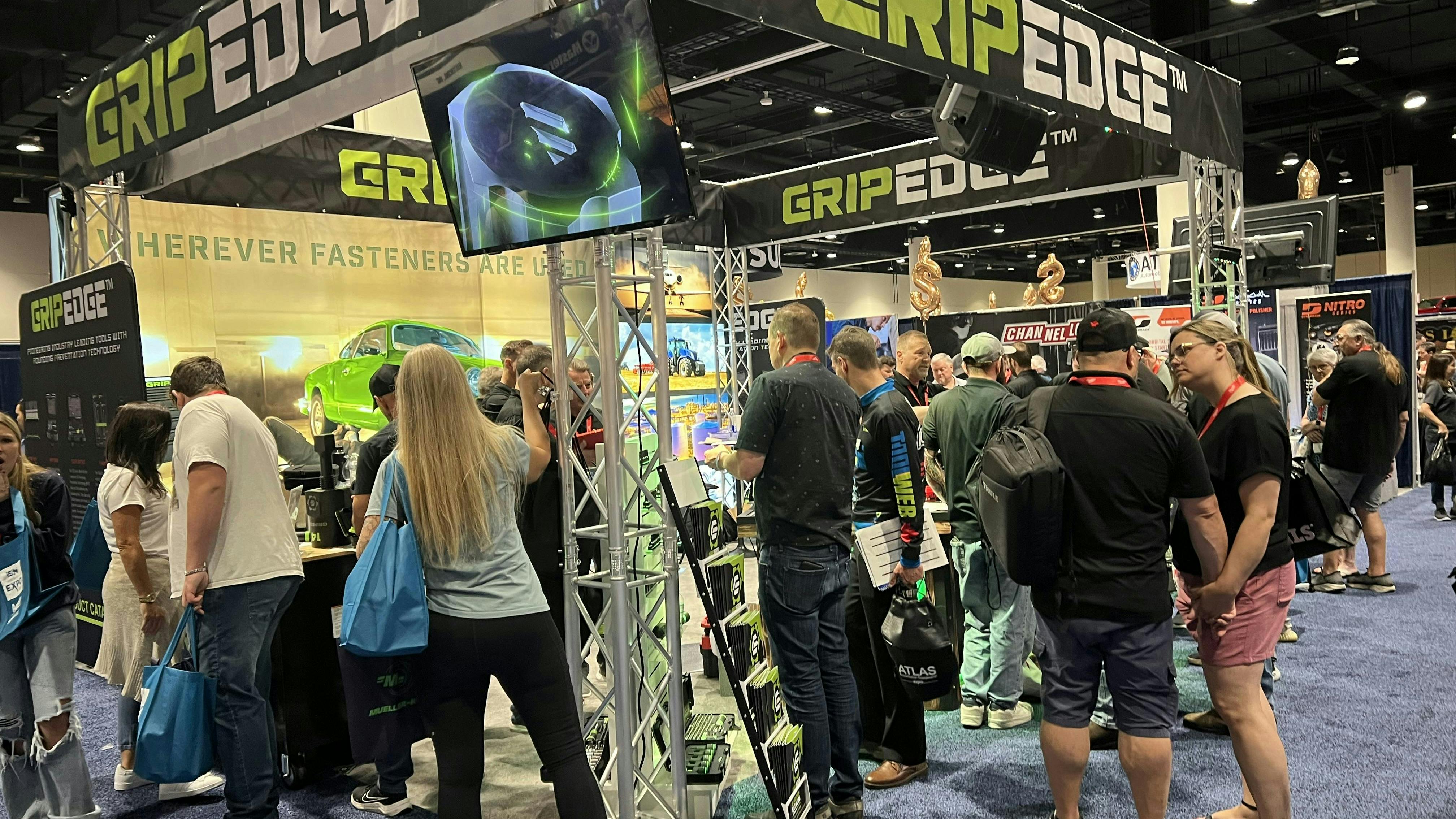 Attendees gathered around the GripEdge booth.