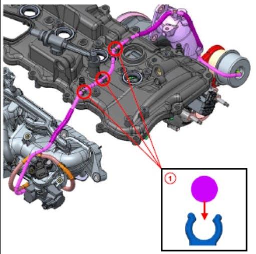 Previous No. 1 vacuum transmitting hose routing. The hose is clamped to the cylinder head cover at three points.