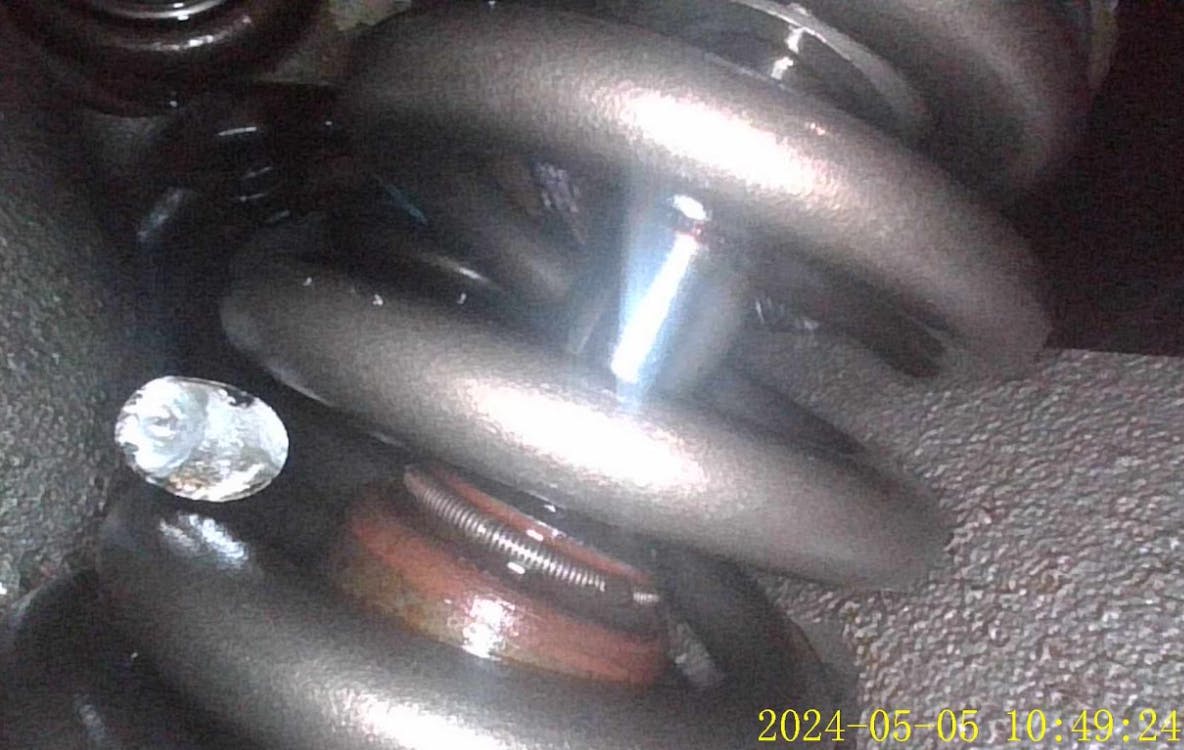 The broken exhaust valve spring is the cause of the driveability fault. Keep in mind that a broken spring can present intermittent faults or faults that only occur under certain operating conditions. It&rsquo;s important to realize that a broken spring can still allow a perfectly passing compression test (or relative compression test) but fail a running test miserably.