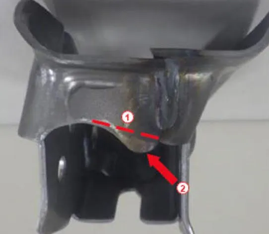 If necessary, trim the support bracket to provide needed clearance. Do not remove more than 5mm of material. The example shown here shows the cut line (1) and area to provide clearance (2).