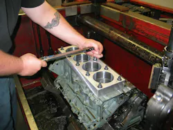 Prior to cylinder honing, the deck plate is torqued to specification to simulate the stress placed on the block when cylinder heads are installed. Prior to cylinder honing, the deck plate is torqued to specification to simulate the stress placed on the block when cylinder heads are installed.