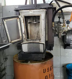 Example of an oil filter crusher. The used engine oil filter is placed in the unit and a hydraulic ram extends downward and crushes the filter. In this example, the oil that is squeezed out runs through an air filter before being drained into the used oil barrel. Example of an oil filter crusher. The used engine oil filter is placed in the unit and a hydraulic ram extends downward and crushes the filter. In this example, the oil that is squeezed out runs through an air filter before being drained into the used oil barrel.
