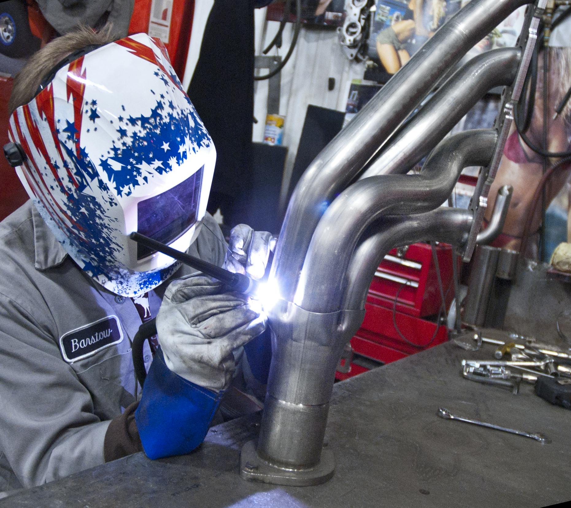 When welding, wear an approved welding helmet with auto- darkening lens, welding gloves and shirt sleeves fully extended.