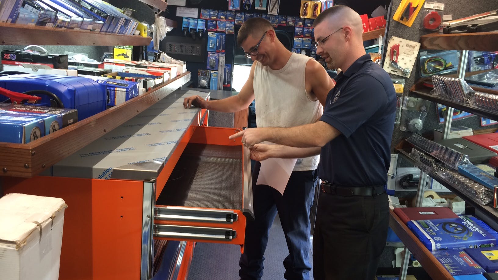 Cornwell Tools Dealer Sean Ostler (pictured In Foreground) And A Customer Check Out One Of The Toolboxes On Ostler's Truck