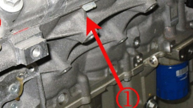 Cylinder head locating tabs should be towards the front of the engine. In this left side example, the tab is correctly close to cylinder 3.