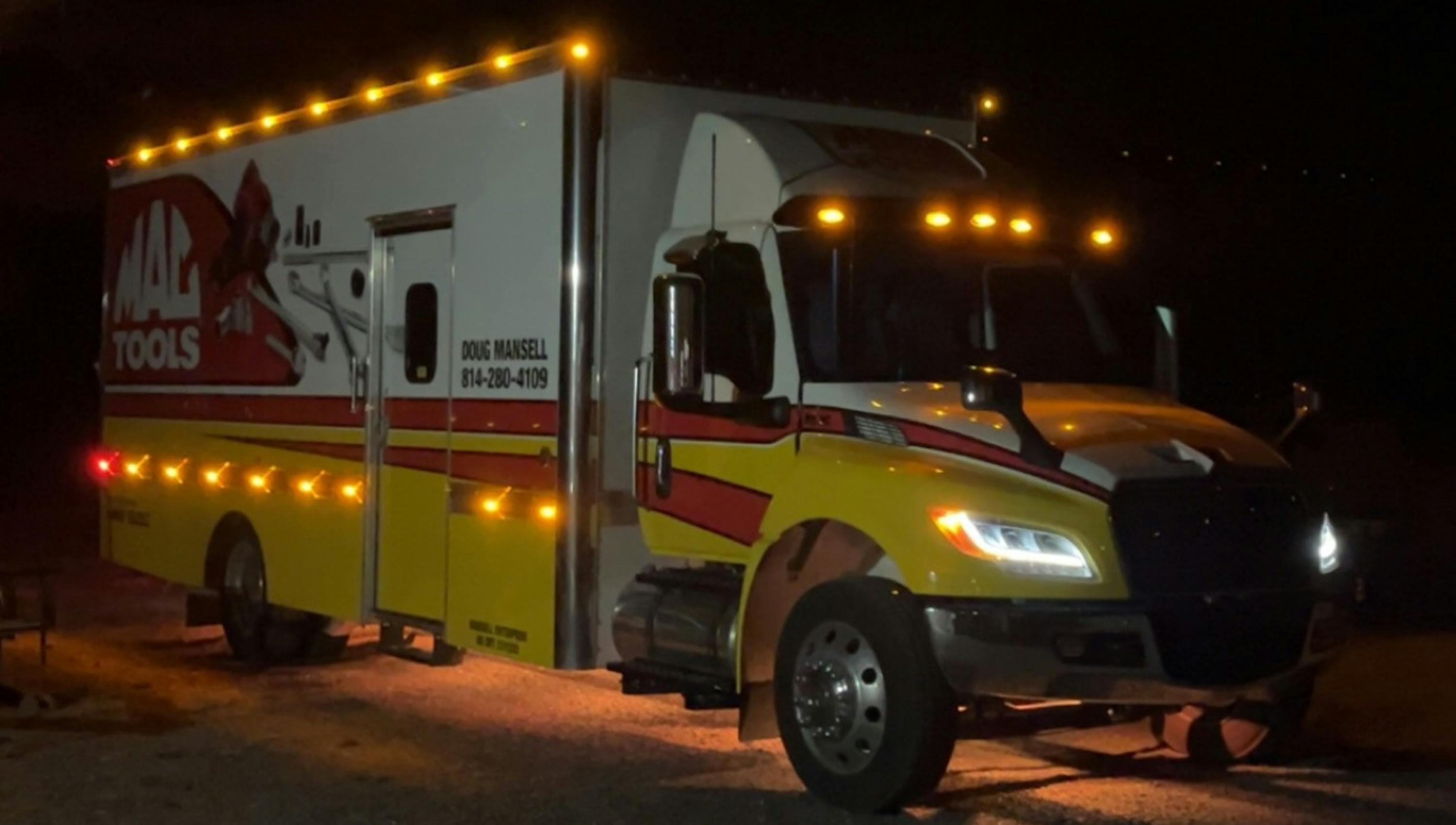 LED lights on the top and sides of Mansell's truck help announce his presence at early morning or evening stops.
