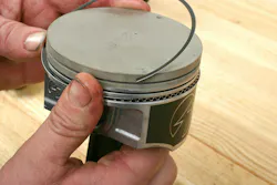 With the expander installed, next install the lower oil scraper ring. This will secure the expander ring, keeping the expander ends butted together. Next install the upper scraper ring. This completes the oil ring package. Be sure to orient the clock positions of the upper and lower scrapers to keep their end gaps far away from each other (90 degrees apart, 180 degrees apart, or whatever orientation specs recommend. With the expander installed, next install the lower oil scraper ring. This will secure the expander ring, keeping the expander ends butted together. Next install the upper scraper ring. This completes the oil ring package. Be sure to orient the clock positions of the upper and lower scrapers to keep their end gaps far away from each other (90 degrees apart, 180 degrees apart, or whatever orientation specs recommend.