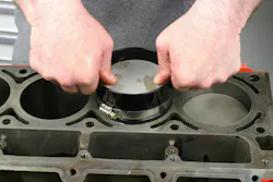 Insert the package into the bore, keeping the bottom of the ring compressor firmly flat against the block deck. Insert the package into the bore, keeping the bottom of the ring compressor firmly flat against the block deck.