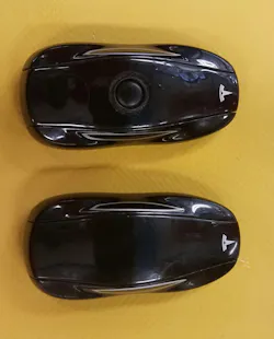 Figure 1: A key fob for older Teslas. Most owners use their cell phones as keys. Figure 1: A key fob for older Teslas. Most owners use their cell phones as keys.