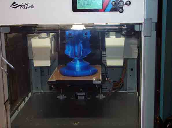 One of three XYZprinting DaVinci 3D printers at Royal Machine producing a workholding fixture model in preparation for final manufacturing