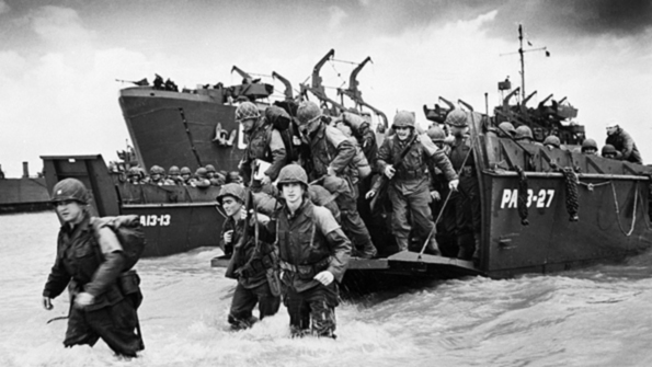 US troops move ashore at Omaha Beach June 6 1944 The Normandy Invasion involved 156000 Allied troops against more than 50000 Axis defenders The American British Canadian and French troops with various others successfully landed and captured five beachheads on the Atlantic Coast starting the advance on Germany that ended World War II in Europe 10 months later