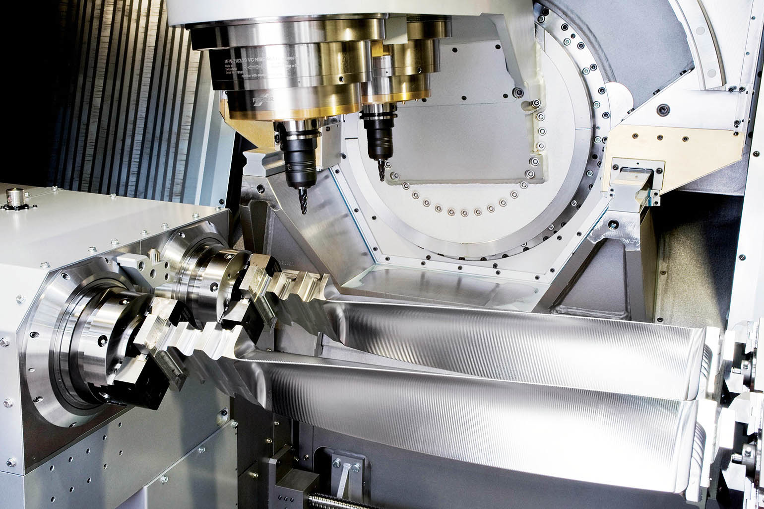 The Turbomill 1400 g uses its large size, weight, and rigidity to counter the forces generated by the 1-g acceleration/deceleration rates it achieves through three-dimensional machining.