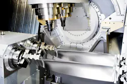 The Turbomill 1400 g uses its large size, weight, and rigidity to counter the forces generated by the 1-g acceleration/deceleration rates it achieves through three-dimensional machining. The Turbomill 1400 g uses its large size, weight, and rigidity to counter the forces generated by the 1-g acceleration/deceleration rates it achieves through three-dimensional machining.