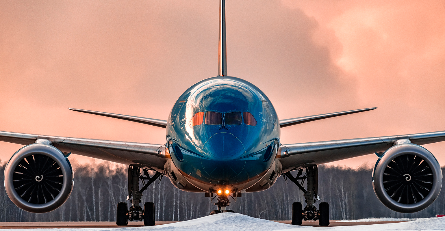 Boeing 787-9 Dreamliner taxiing on the runway.
