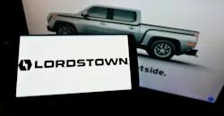Cellphone with logo of Lordstown Motors Corporation on screen in front of webpage. Cellphone with logo of Lordstown Motors Corporation on screen in front of webpage.