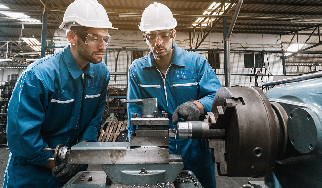 Engineering team checking machine safety.