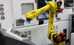 Robot tending a horizontal CNC machine. Robot tending a horizontal CNC machine.