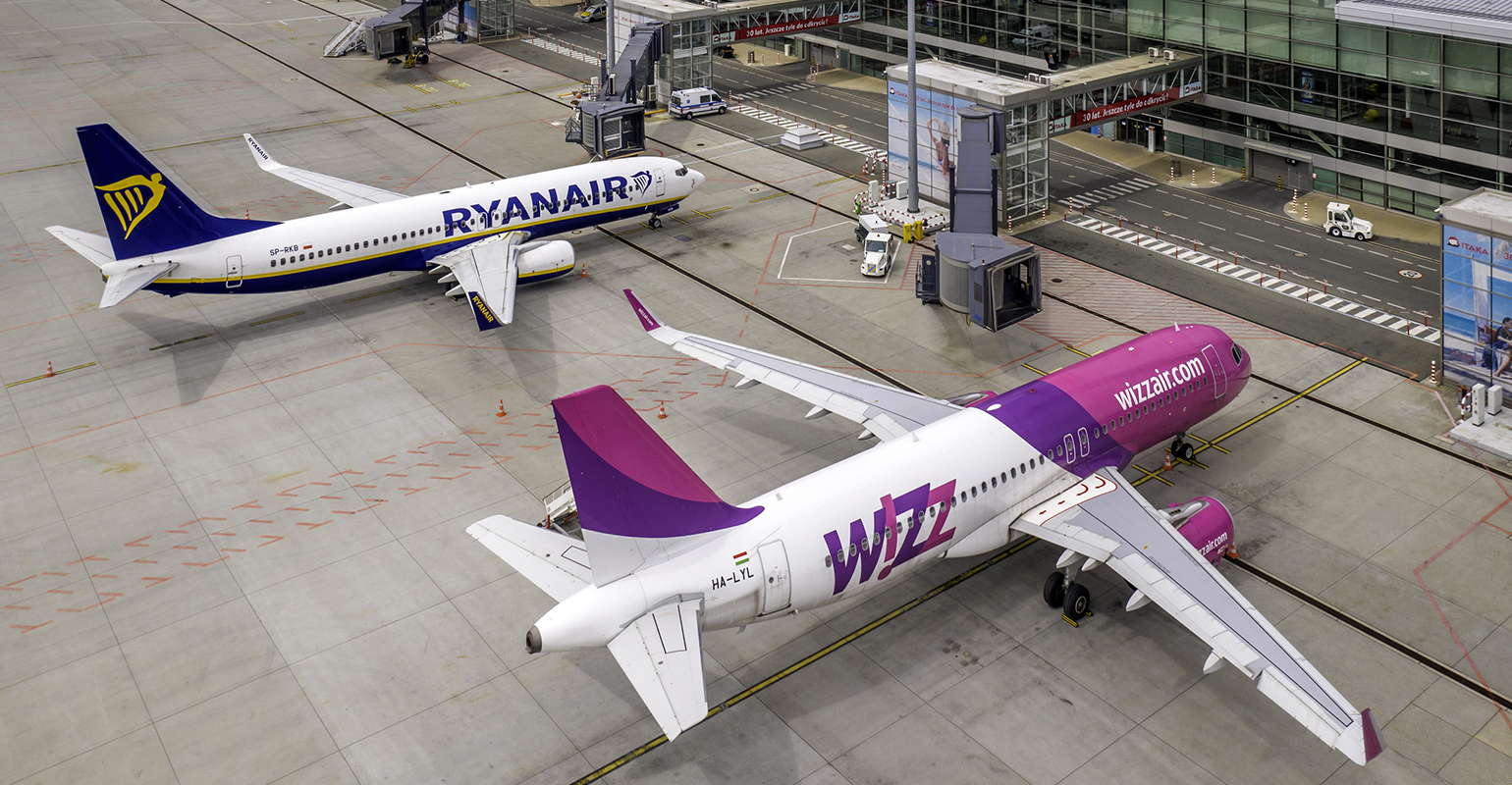 Airbus A320 and Boeing 737 aircraft at Wroclaw Airport, Poland. Aerial airplane photo taken by drone.