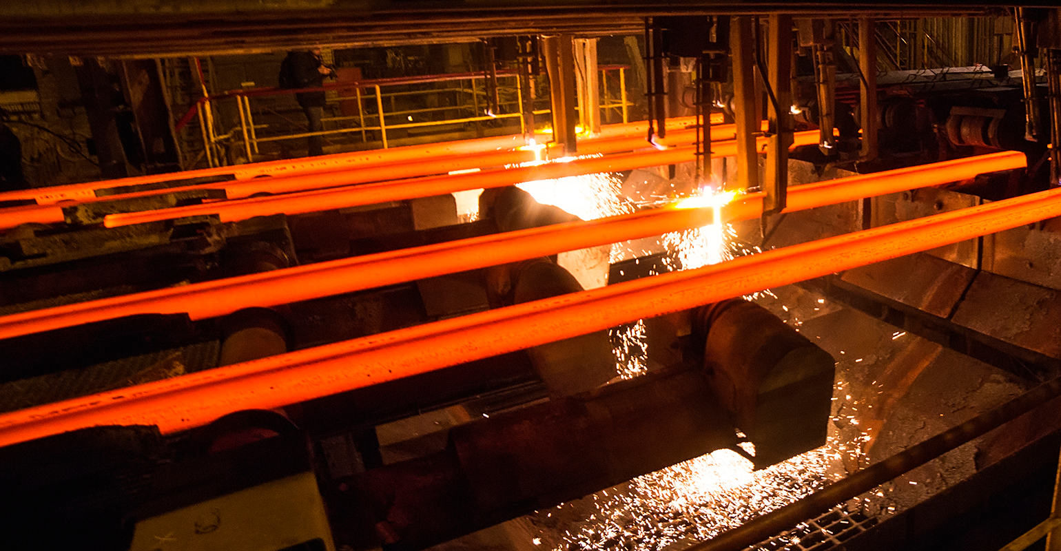 Steel billets, torch cutting at the run-out stage of continuous casting.