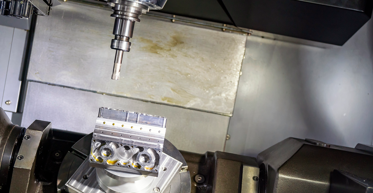 Five-axis CNC machine.